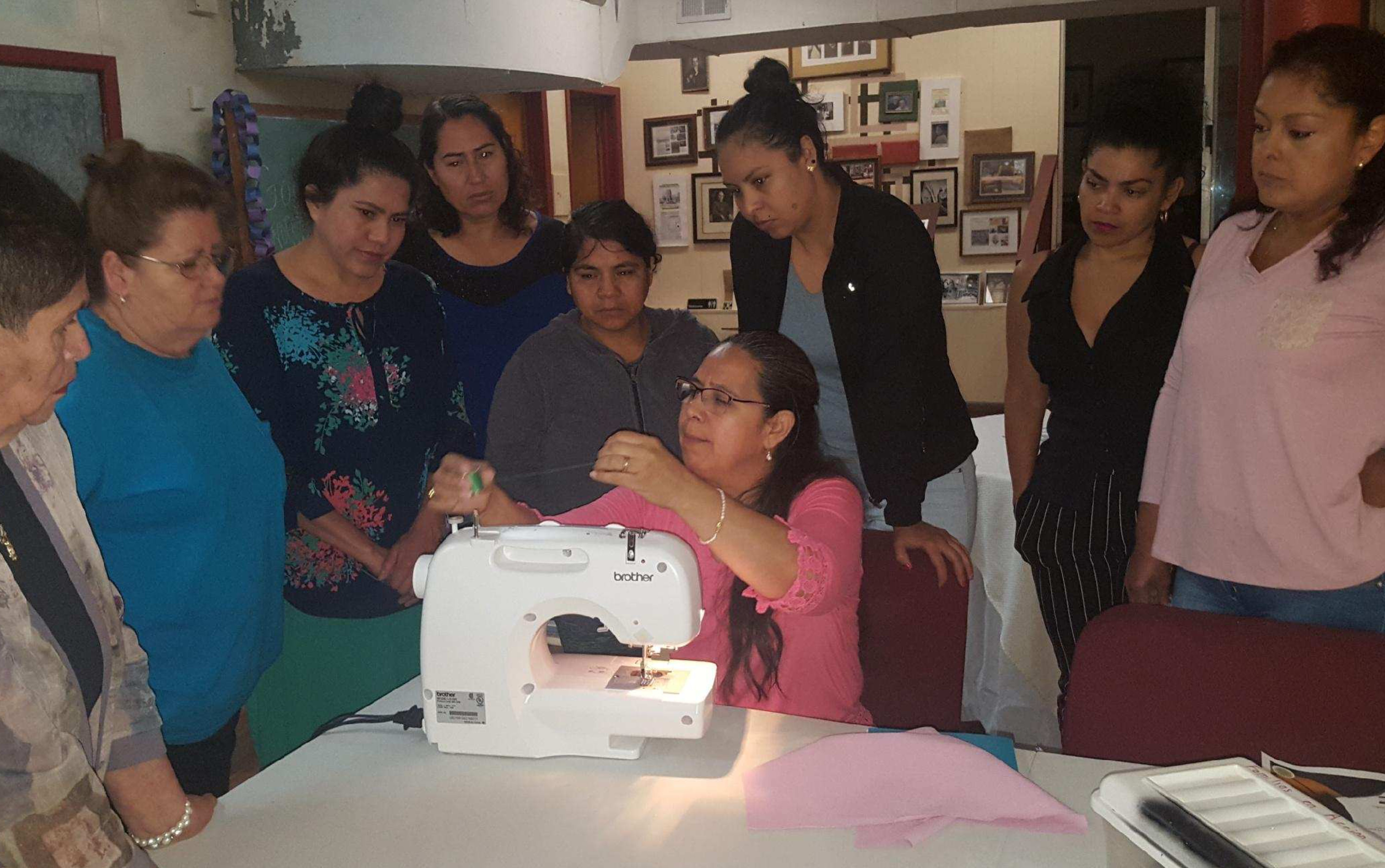 Ramona teaching how to sew